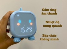 Trên tay đồng hồ báo thức khủng long, cảm ứng âm thanh, đo nhiệt độ xung quanh.